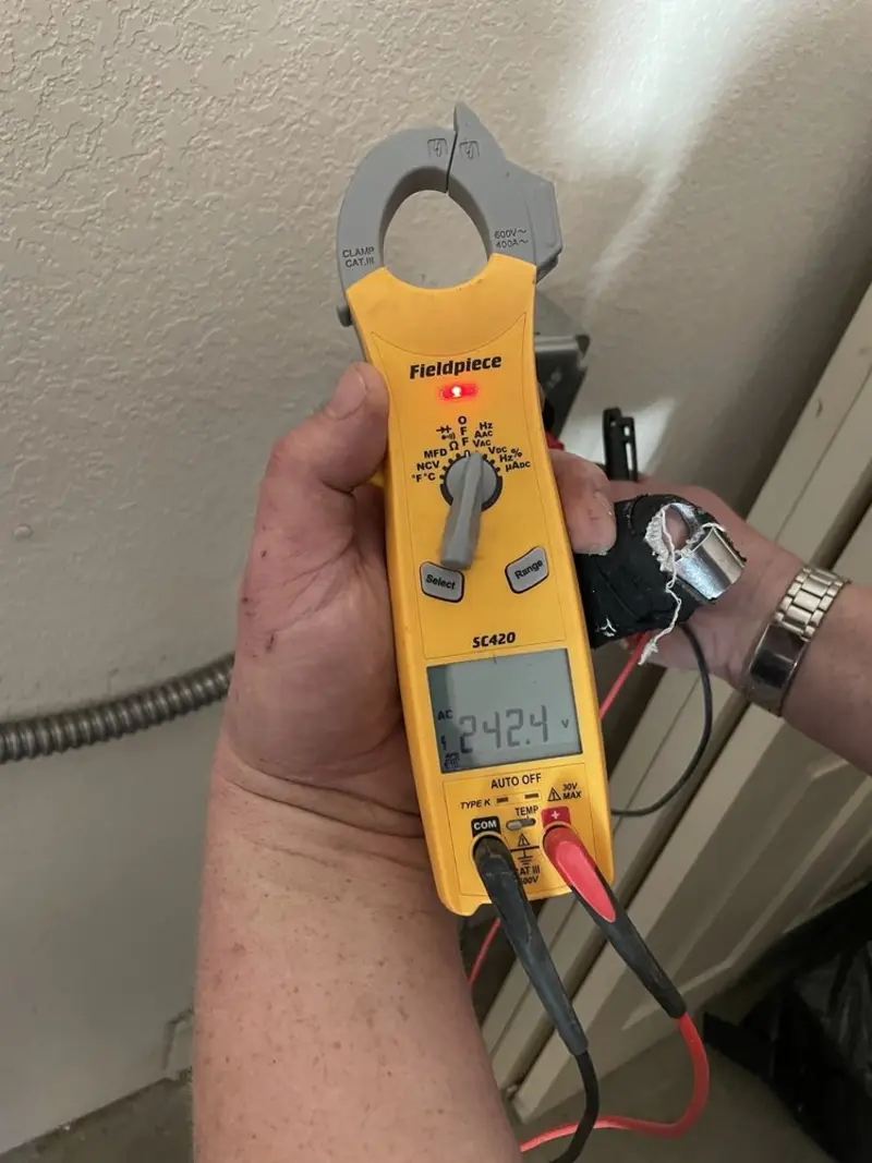 Voltage testing with clamp meter during Electrical Installation Services in Ada